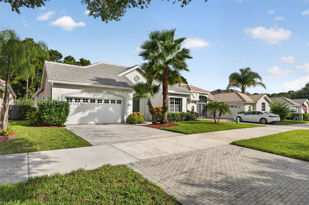 Photo of 619 SW Lake Charles Cir, Port St Lucie, FL 34986 (MLS # A12089353)