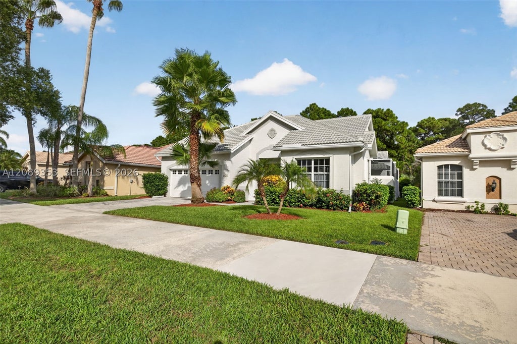 Photo of 619 SW Lake Charles Cir, Port St Lucie, FL 34986 (MLS # A12089353)