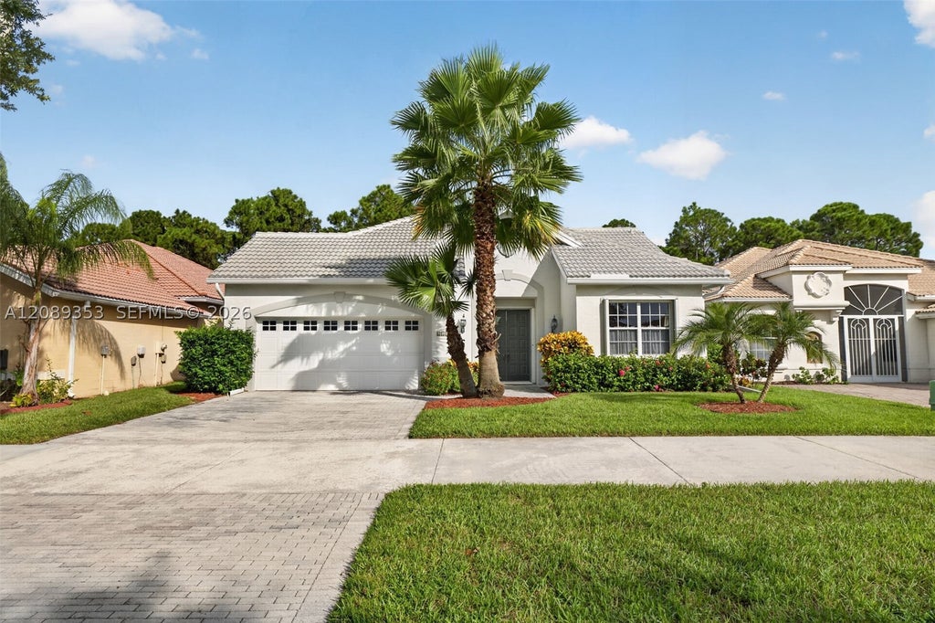 Photo of 619 SW Lake Charles Cir, Port St Lucie, FL 34986 (MLS # A12089353)