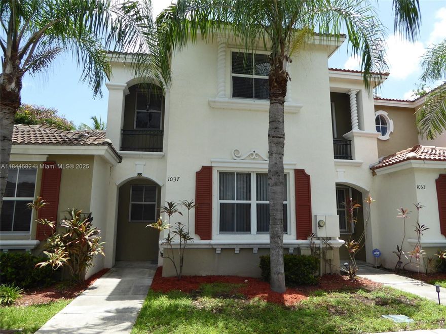 Spacious 2 story townhome newly renovated with all new vinyl wood flooring throughout. The whole house is freshly painted with a perfect color that matches the new variegated light grey and beige floors with all new white base boards. Nice floor plan with a formal area for the dining room and large living and family rooms. Open kitchen with island sink, storage and electric outlets for plug in kitchen items. Wide snack counter will allow for many stools. Fenced backyard with storge room and hurricane shutters and tall ladder. Complex has security gate entry with a call box for visitors. Marbella Bay has play area on site and a community pool and gym with clubhouse in driving distance. 2 parking spaces in front of the unit makes it easy to get those grocery's inside. Close to turnpike
