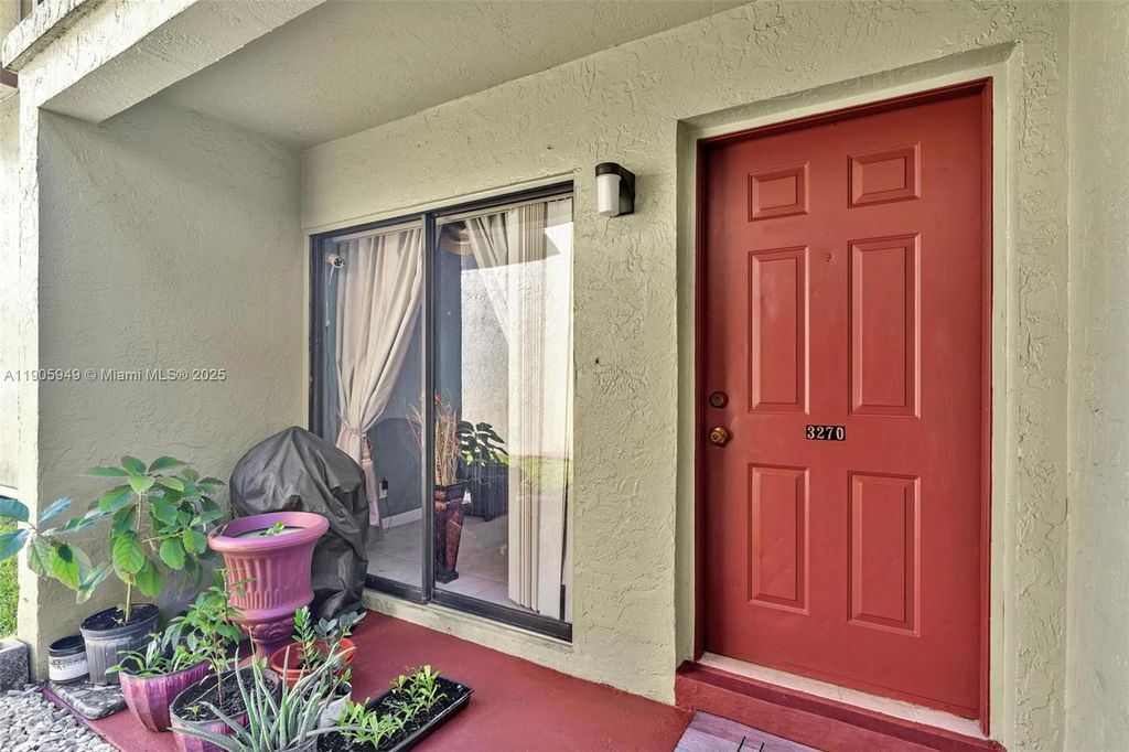 Photo of 3270 NW 104th Ave #3270, Coral Springs, FL 33065 (MLS # A11905949)