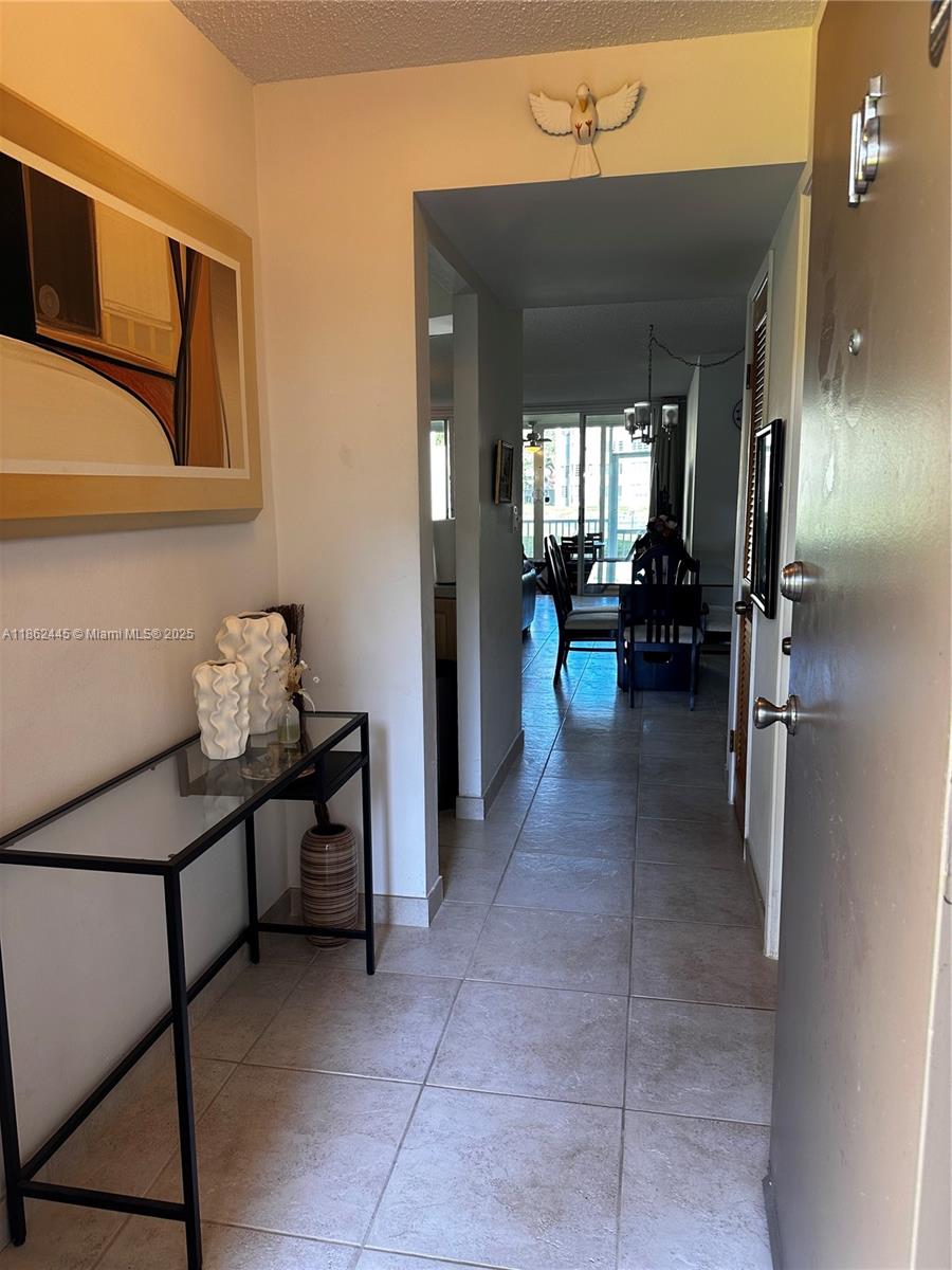 This charming first-floor unit features an open layout, large den perfect for a home office or extra living space. The generous walk-in closet provides ample storage, and the enclosed balcony with hurricane-impact sliding doors offers serene lake views. The entire unit is finished with beautiful stone tiles, creating a seamless, modern look throughout.
Ideally situated near beautiful beaches, places of worship, restaurants, supermarkets, and the scenic Oleta River State Park. Enjoy easy access to both Miami and Fort Lauderdale Airports.
The unit can be rented after two years of ownership. Maintenance fees include cable and internet.