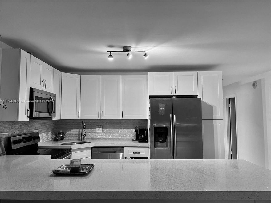 This gorgeous one-bedroom + 2 Big dens, featuring 1.5 baths and an open concept design, beautiful white tile flooring, and a modern kitchen equipped with granite countertops and stainless steel appliances. High smooth ceilings, loft style, breathtaking direct views of Maule Lake.  
Fantastic location and amenities, including two large pools with renovated decks, a fitness center, tennis courts, and 24-hour security, 1 assigned parking spaces. 2nd-floor unit convenient, walking distance to the temple of worship (Synagogue) Restaurants, groceries, parks, banks. Close to Aventura Mall. 40 Year Cert completed. 2-year ownership is required to rent. Assessment will be paid in full at closing. Motivated to sell, negotiable price.