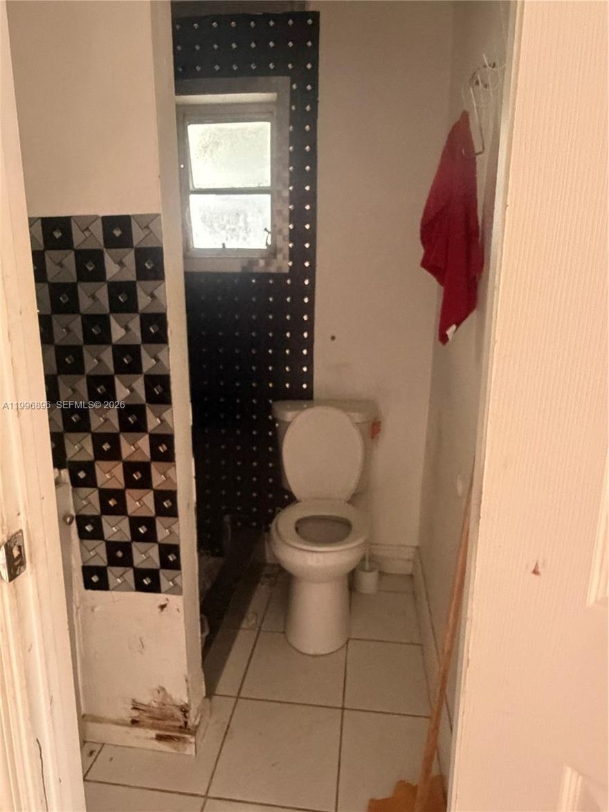 This is your chance to redevelop this property just off Calle Ocho. Located just one black from Cafe La Trova, Bargean, Habana con B and Calles Dragones and so much more. Only 5 munutes to Brickell. This property is perfectly situated to build a new investment property. The current buildings are a main house with an efficiency in the back and two additional efficiencies separate from main house. The current structures are in poor shape and need work.