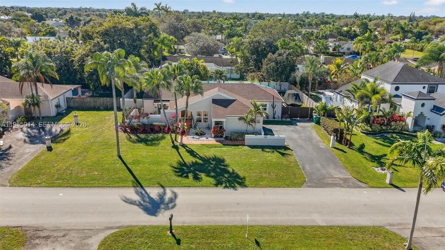 You've found your stunning Tropical Oasis! Spacious and well-maintained home near Country Walk & Zoo Miami, sits on an expansive 13,000+ SqFt lot. Enter into a formal living/dining area with family room- perfect for entertaining, tons of natural light, high ceilings, and elegant tile floors! Kitchen features granite counter tops, tons of storage and additional pantry/mud room, and newer SS appliances. Split floor plan with primary on one side of the home, and 3 additional bedrooms on the other side of the home with a convenient cabana bath! Primary suite features a walk in closet and second closet, spacious bathroom with tub and shower, and patio views! Huge covered patio with space for a BBQ and entertaining, serene pool, native tropical plants attract butterflies and hummingbirds, plus mango, avocado, and bananas trees and pineapple plants! There is 19 feet on the side of the house perfect for your boat or RV! Roof is 1 year old, A/C is 2 years old, complete impact windows and doors, and septic was serviced this year! Owners have impeccability maintained this home so that you can buy with peace of mind! Move in Ready!!!
