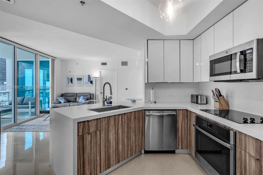 Boutique Condo with Beautiful Bay & Skyline Views! Enjoy views of Biscayne Bay & the Miami skyline from this magnificent 2-bed, 2-bath plus terrace. Modern Design, high ceilings, and floor-to-ceiling windows that flood the space with natural light. Renovated kitchen, stainless steel appliances, granite countertops, and an in-unit washer & dryer for ultimate convenience. Resort-style amenities include a lap pool on the 6th floor, state-of-the-art fitness center, sauna, heated pool, spa,BBQ area,concierge,and 24-hour security. Located in the heart of Edgewater, you're just minutes from Midtown, Wynwood, the Design District, Downtown, I-95, 836, and the Beaches. Walk to Publix, Starbucks, top restaurants, and vibrant nightlife!