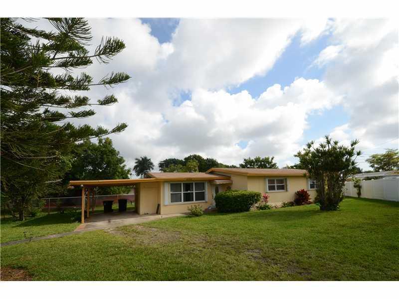 Located on a great oversize lot. This home is simply perfect and ready for you to make it your home. 3 bedrooms, 2 baths with ample living area with wood floors, open kitchen to dining area. separate laundry room, carport, shed, and a great cover patio f or entertaining. Newer roof, a/c & water heater. hurricane shutters. come and rent this home!