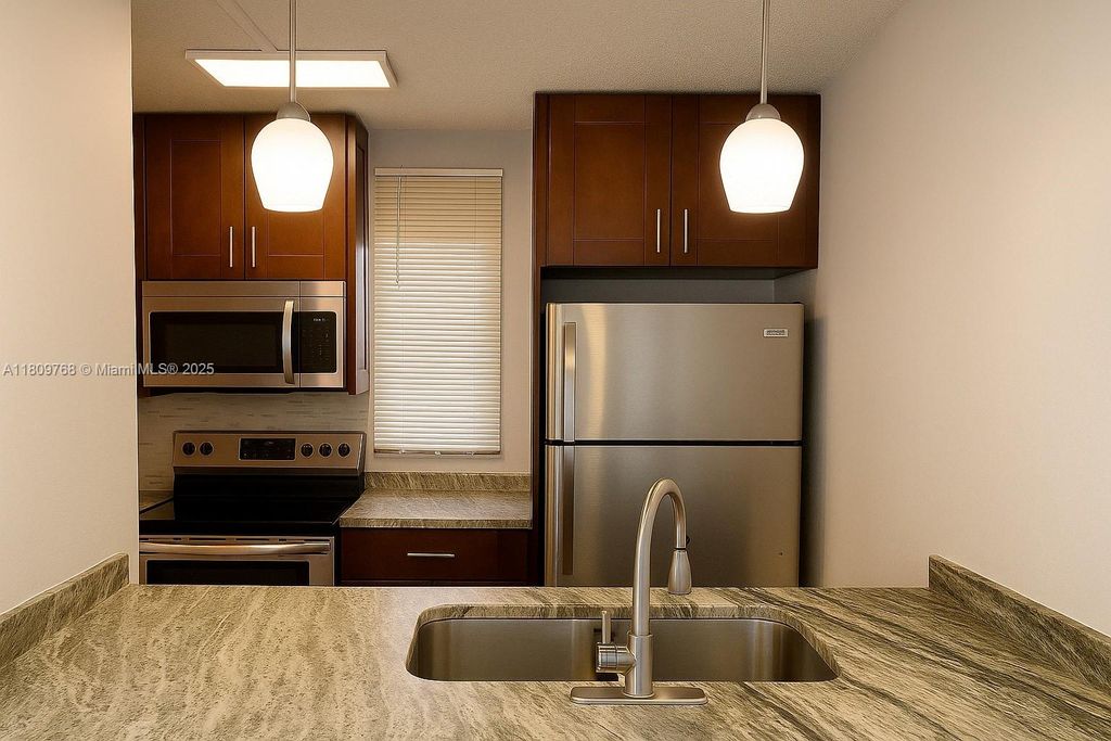 Photo of 9909 Twin Lakes Dr #26-F, Coral Springs, FL 33071 (MLS # A11809768)