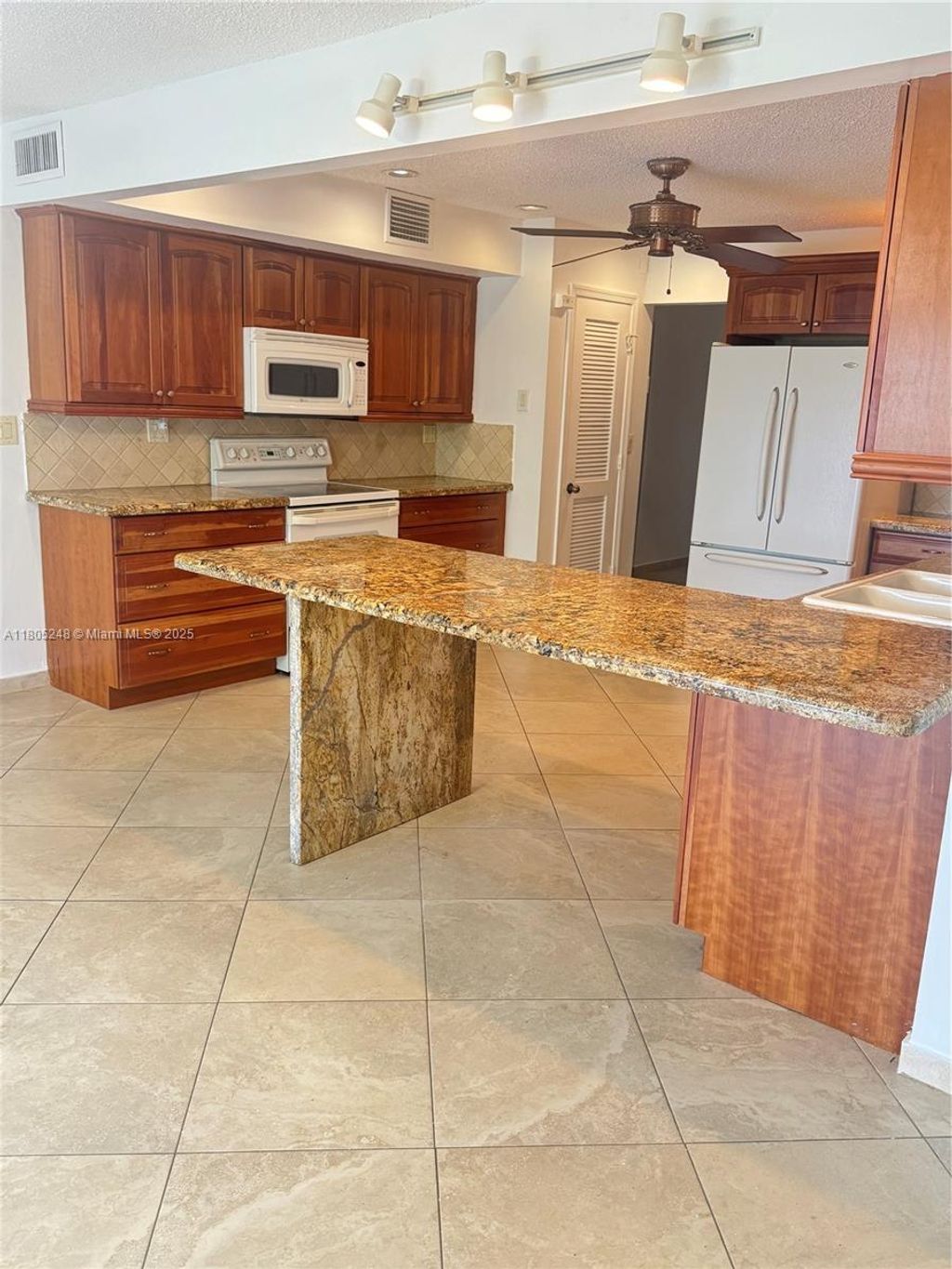 Photo of 3111 Coral Springs Dr #215, Coral Springs, FL 33065 (MLS # A11805248)