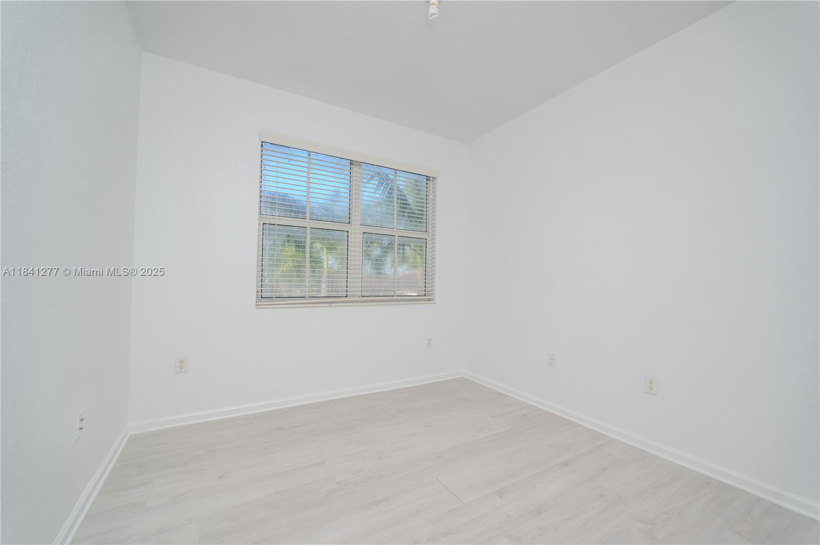 Beautiful corner unit, one of the largest models with 1,280 SF. Impeccable and bright with ample space. Ceramic floors on the 1st floor and laminated wood on the 2nd floor. Blinds on every window. The kitchen has wood cabinets, stainless steel appliances, and granite countertops. 1 assigned parking space and plenty of guest parking for 2nd car - must be registered with condo Assn. Enjoy St. Moritz's exclusive community pool + The Islands at Doral Clubhouse with tennis & basketball courts, a large swimming pool, a playground, and a recreation area. Unit is conveniently located close to Dr. Toni Bilbao K-8 School, Ronald Reagan Senior High School, and Doral Legacy Park.