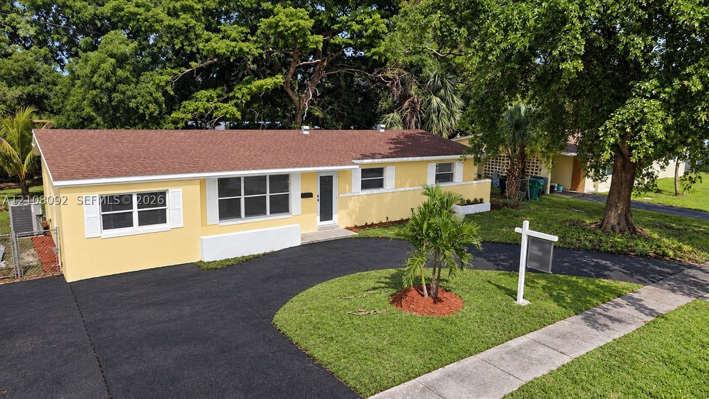 Photo of 3621 NW 6th Pl, Lauderhill, FL 33311 (MLS # A12108092)