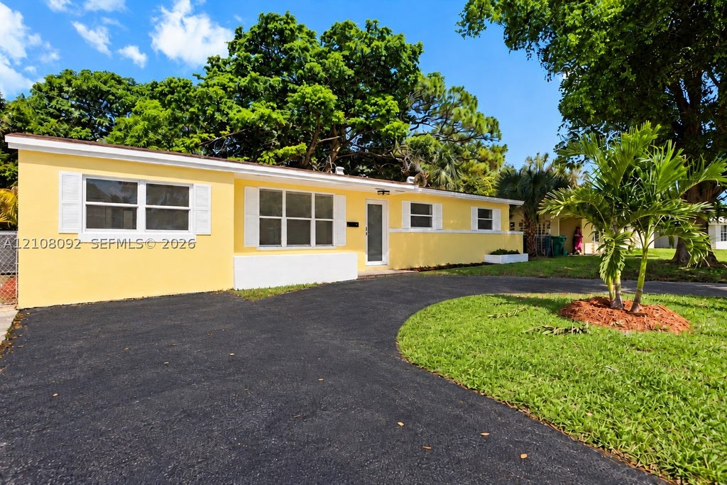 Photo of 3621 NW 6th Pl, Lauderhill, FL 33311 (MLS # A12108092)