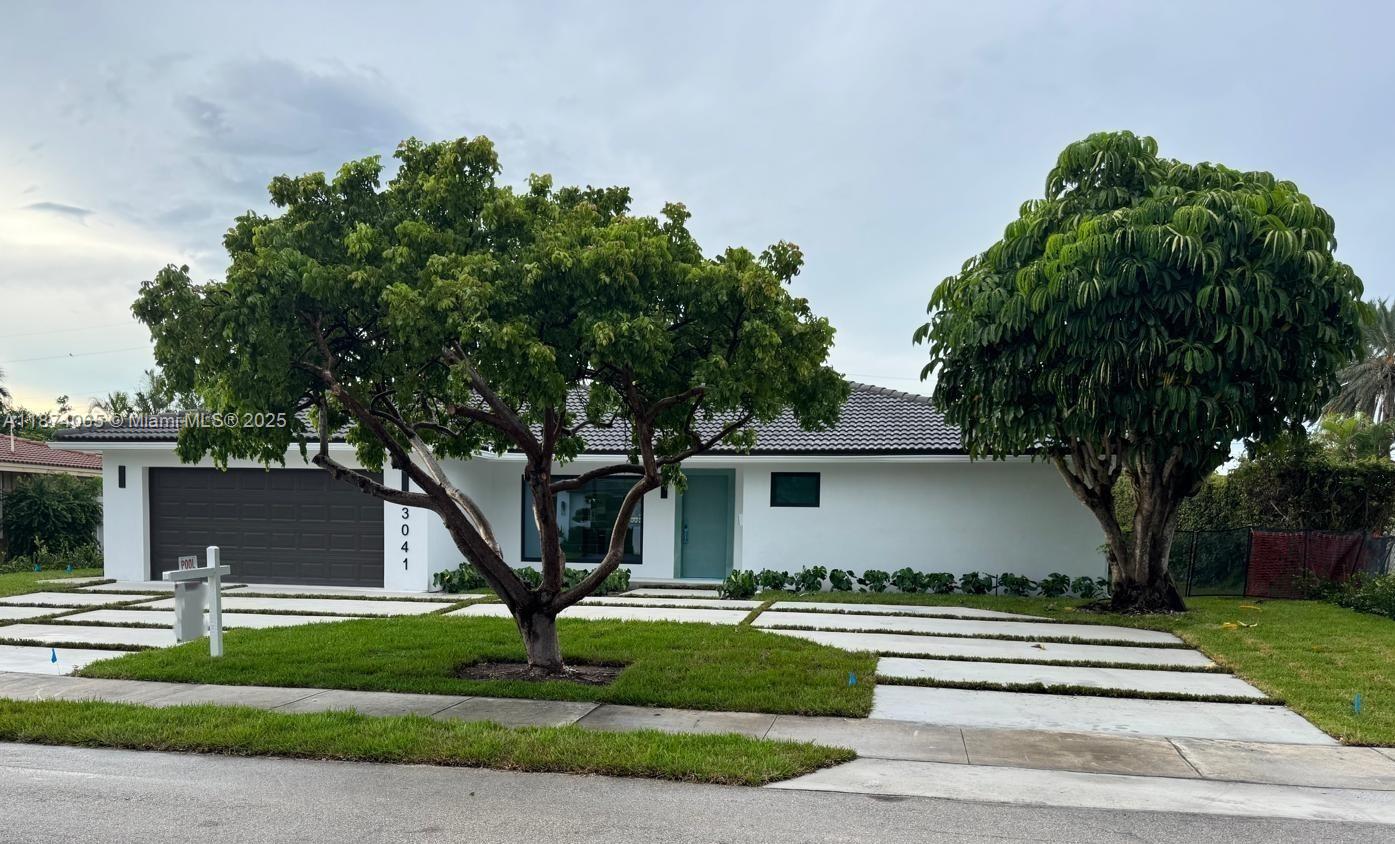 Spectacular fully remodeled 4BR/3BA single-family in Lighthouse Point! This light-filled home features an open floor plan with big format porcelain floors, a chef’s kitchen with quartz countertops and all new stainless steel appliances, plus indoor laundry and walk-in closets. Updates include new plumbing, electrical, driveway, and 2025 hurricane impact windows & doors. Enjoy modern bathrooms, a 2-car garage, and seamless design with no visible beams. Outside, relax by the in-ground pool, paved backyard, and new sprinkler system. Everything is absolutely mint—move-in ready!