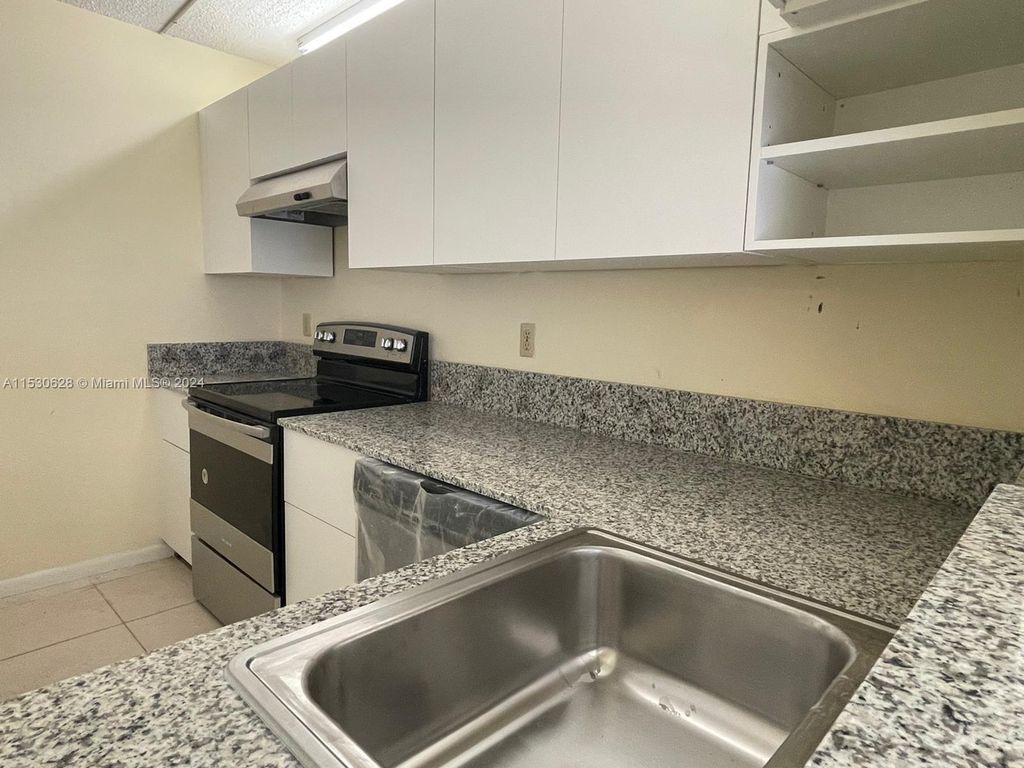 Photo of 820 Twin Lakes Dr #820, Coral Springs, FL 33071 (MLS # A11530628)