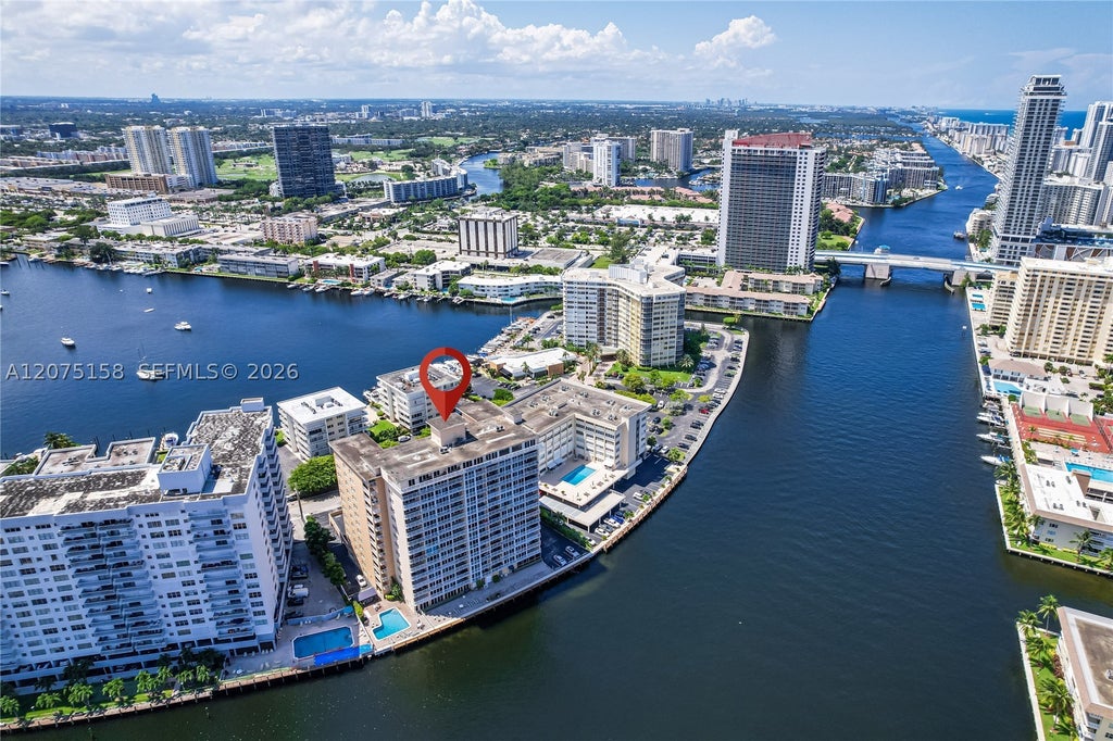 Photo of 121 Golden Isles Dr #907, Hallandale Beach, FL 33009 (MLS # A12075158)