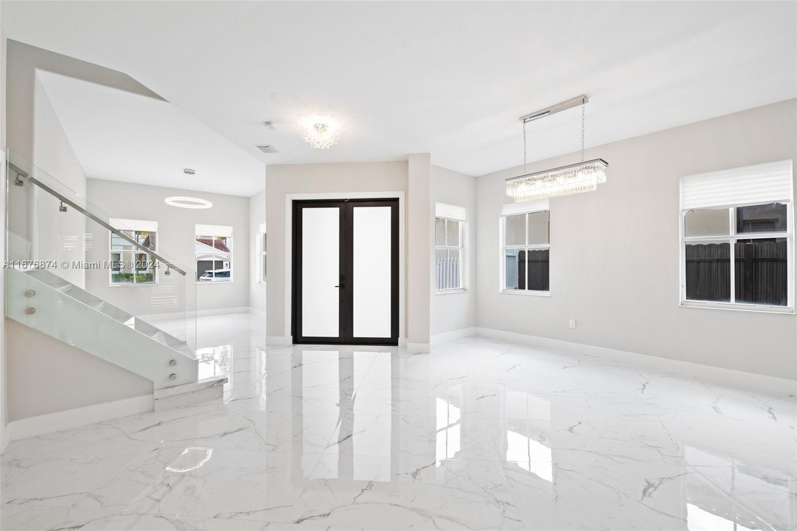 Beautifully remodeled home with modern finishes throughout. The first-floor features elegant porcelain flooring, while the second floor boasts warm bamboo wood for a touch of natural charm. "This home features a spacious master bedroom and a full bathroom conveniently located downstairs, with a private door leading directly to the outside for easy access. new and spacious kitchen is crafted with exquisite taste, featuring brand-new stainless-steel appliances, a master bathroom with a luxurious floating bathtub, beautiful dual vanities and thoughtfully designed spaces that offer both elegance and comfort. , featuring 5 Bedrooms, 3.5 Bathrooms, and double car garage. Fully fence patio with space for a pool, tiki house, or more. Close to the A+ schools, major highways, shops etc. NO HOA!