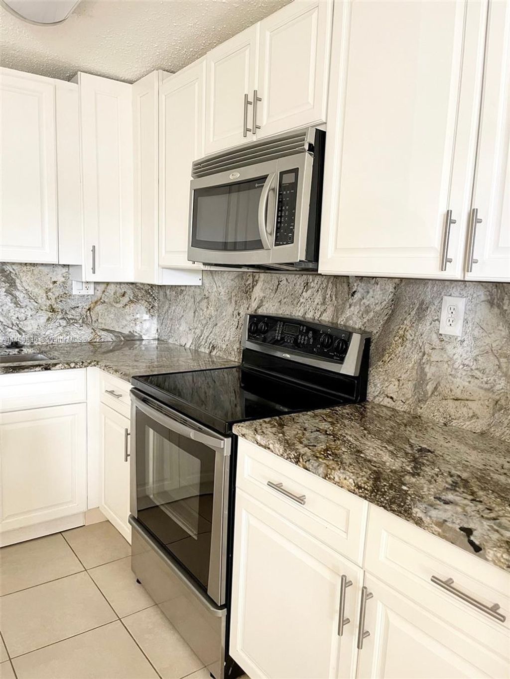 Photo of 105 Meadows Cir #105, Boynton Beach, FL 33436 (MLS # A11453830)