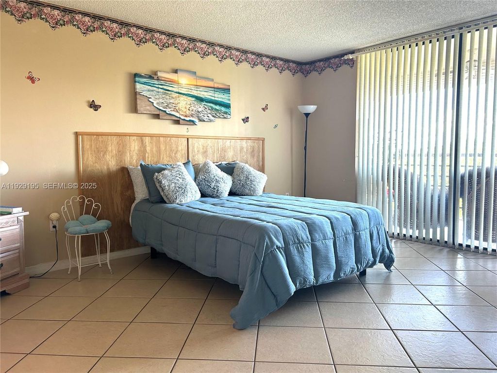 Photo of 900 Saint Charles Pl #606, Pembroke Pines, FL 33026 (MLS # A11929195)