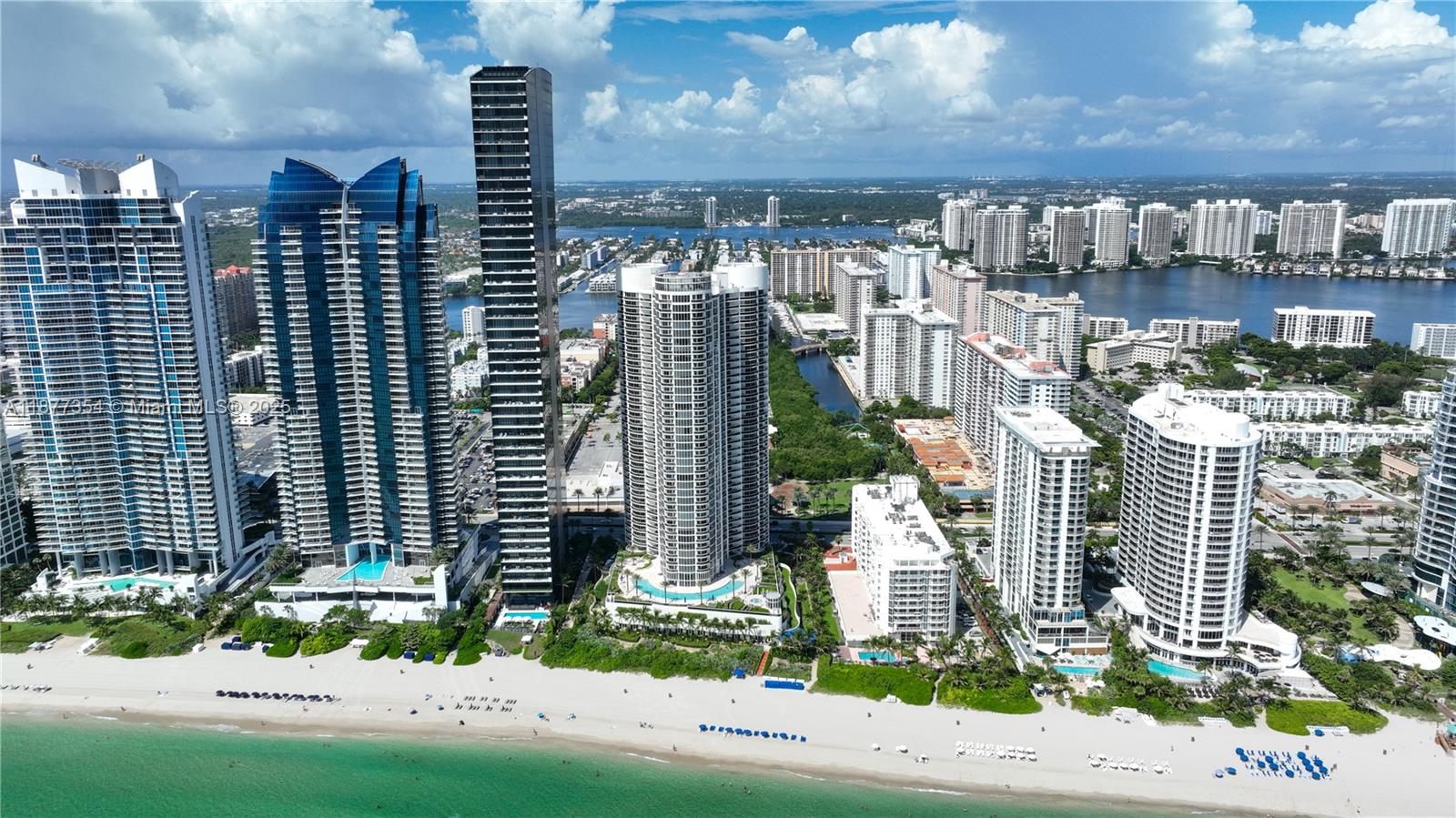 Gorgeous apartment on the beach! This is a split 2 Bedroom 2 Bath floor plan, each room has its own attached bath and balcony access. This 5 star building includes, 24hr valet parking and concierge, beach access/services, amazing beachside restaurant, pool with an ocean view. Gym with sauna, yoga classes and much more. Unit comes with one assigned parking spot plus complimentary valet for a second vehicle. Located close to shopping, dining and public parks. Do not miss this opportunity. Seller motivated. Furnishing can be included at buyers request.