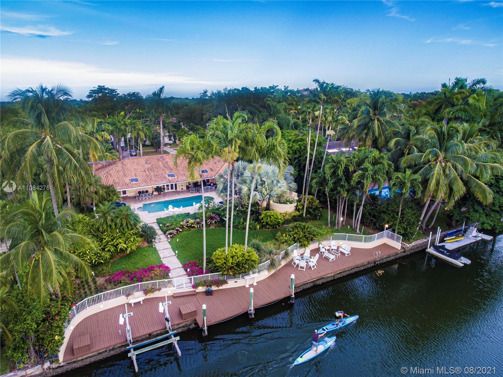Spectacular WATERFRONT home with an address to match, on the most sought after Riviera Drive, Coral Gables wide waterway, East of US-1. 5-bedrooms, 4Baths, this well maintained home has a large pool, covered patio, impact windows and doors, summer kitchen large living areas, hot tub off the master suite. It is walled in, has circular driveway and two car garage. The property is beautifully landscaped, and has a large dock and boat lift on the widest section of the waterway. homes like this, rarely come on the market, as those who buy on the Riviera waterway usually stay for decades as is the case with this home. The Coral Gables waterway has two 18 ft + bridges to the bay and is one of the best hurricane harbors in South Florida. This is a unique opportunity.