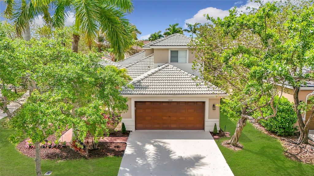 Photo of 1668 Winterberry Ln, Weston, FL 33327 (MLS # A12003581)