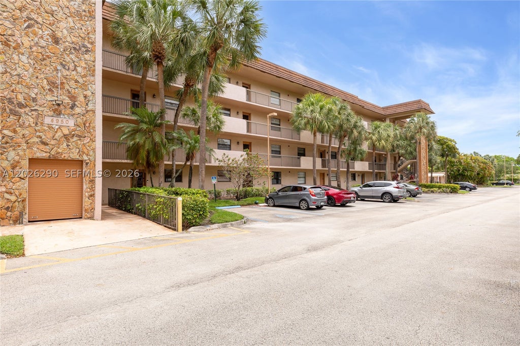 Photo of 4950 E Sabal Palm Blvd #106, Tamarac, FL 33319 (MLS # A12026290)