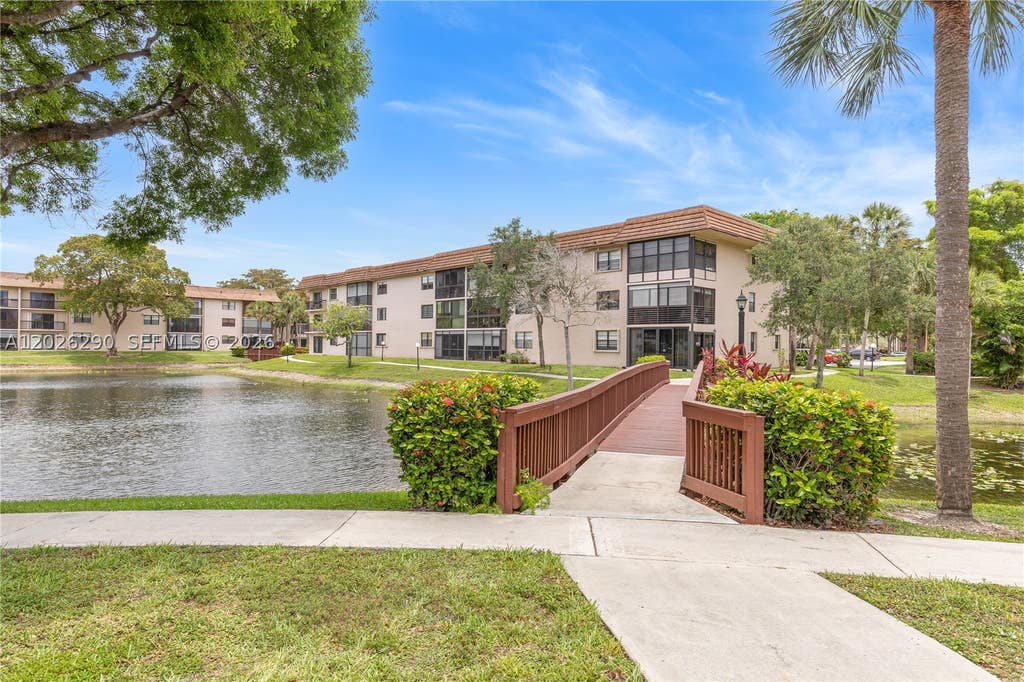Photo of 4950 E Sabal Palm Blvd #106, Tamarac, FL 33319 (MLS # A12026290)
