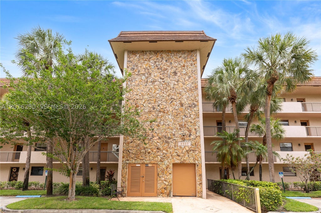 Photo of 4950 E Sabal Palm Blvd #106, Tamarac, FL 33319 (MLS # A12026290)