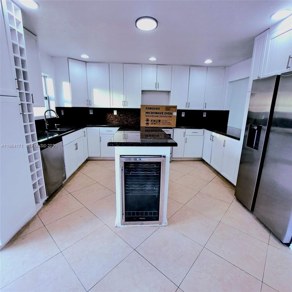 Photo of 3920 Woodside Dr #8, Coral Springs, FL 33065 (MLS # A11964171)