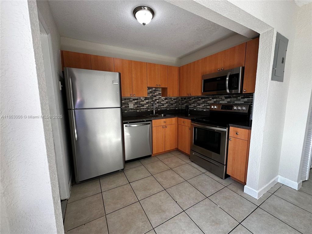 Photo of 4876 NW 9th Dr #4876, Plantation, FL 33317 (MLS # A11863006)