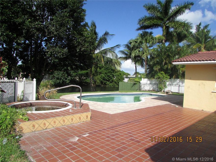 Phenomenal property on canal featuring pool,2 garages, Jacuzzi! Stunning renovation in Coral Springs.Beautiful kitchen dark wood cabinet, stainless appliances and granite counter. Bathrooms refreshed with designer tiles and modern vanities. Separate living areas,big bedrooms lots of closet space. Magnificent covered porch leading to tropical pool, grass and canal !!!
Offering one year home warranty, and/or appraisal credit, when financing with 1st Financial Inc, Michael Alvarez. Call Listing agent.