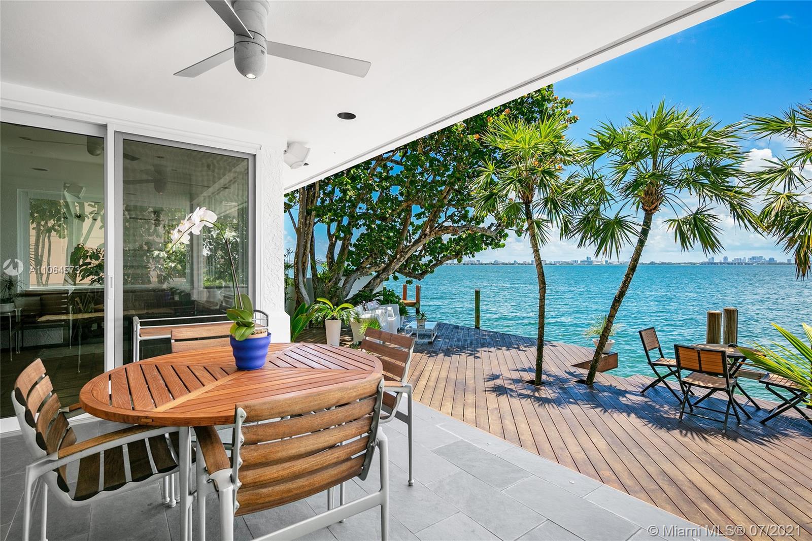 Located in guard-gated North Bay Island this 2-story, 4BR/4BA gem designed by Architect Barry Sugerman offers 70ft of sparkling waterfront facing the downtown Miami skyline w/open Biscayne Bay views. Mexican tile downstairs, carpet & bamboo floors upstairs, soaring ceilings, a wet bar, an office, spacious open living & dining area w/a custom wine cabinet. A large chef’s kitchen sports a breakfast area w/direct bay views. The 2nd floor principal suite features dual walk-in closets, dual bathrooms with direct access to a large terrace overlooking the bay. Outdoor highlights incl. a large bay-facing terrace to entertain w/summer kitchen, mature tropical landscaping, open seating areas, dock and a generator to power entire home. There is also room to build a pool, subject to permit approval.