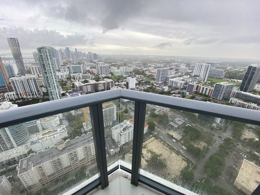Stunning penthouse with 2 bedrooms and 2 bathrooms located in the vibrant Edgewater neighborhood. Massive wrap around balcony with access from the master bedroom and living room. Breathtaking views of the Miami skyline and Biscayne Bay! Amenities include a rooftop pool, tennis court, paddle court, BBQ areas, club room, kids room, billiard's room, theater, fitness center, spa, 24 hour valet parking and 24 hour concierge. Within walking distance from the Design District, Midtown and Wynwood. Only 15 min to Miami and Miami International Airport, 5 minutes to Miami Beach.
