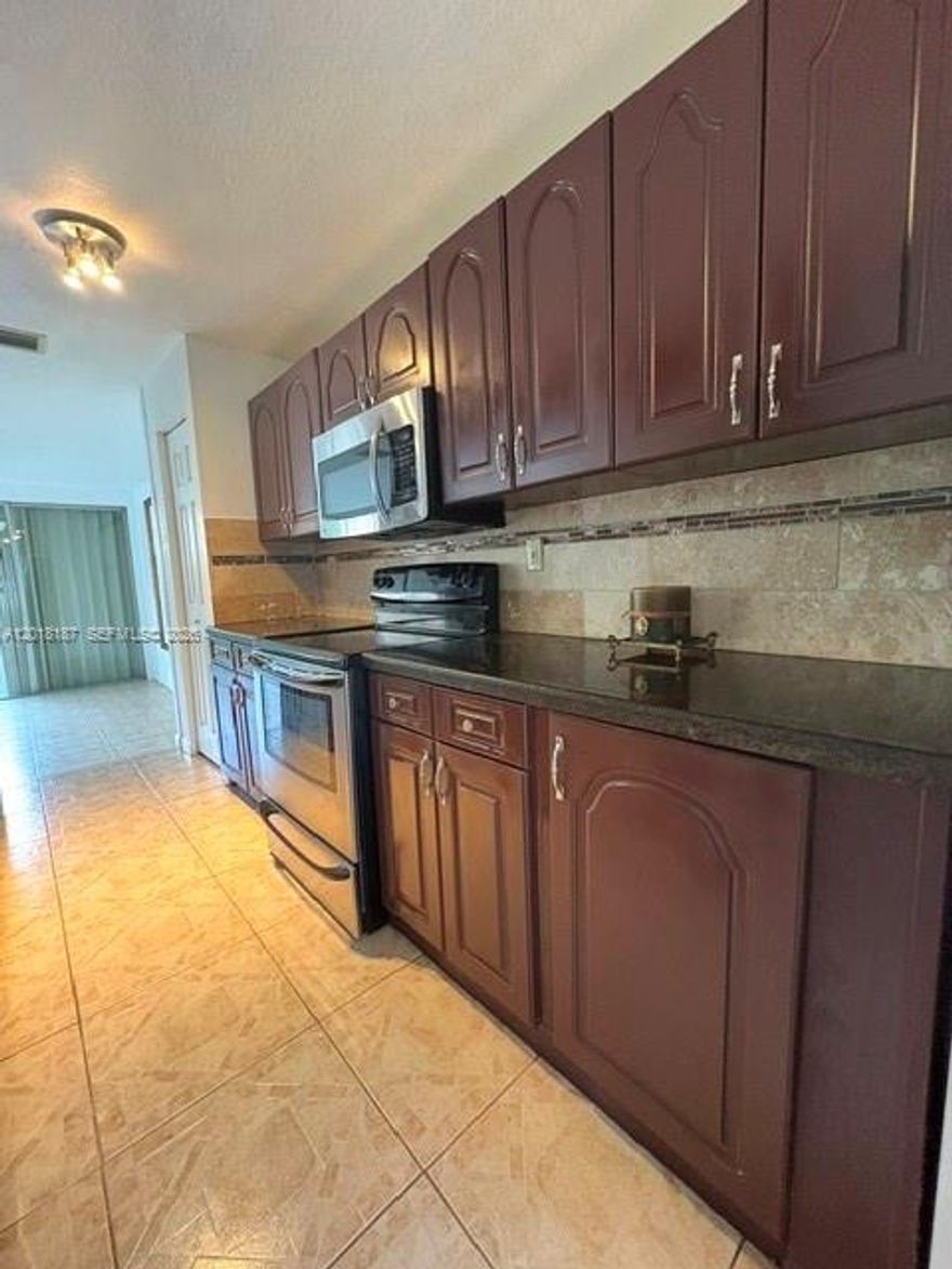 This residence offers generous proportions, quality updates, and a layout that maximizes every square foot—features experienced investors value. With 3 spacious bedrooms and 2.5 bathrooms, all bedrooms on the second floor ensure privacy and strong rental appeal. The primary suite includes a walk-in closet and natural light, while guest rooms feature custom closets and a full bathroom with bathtub.

The open-concept kitchen provides bright, inviting living areas, equipped with stainless steel appliances, granite countertops, ample storage, and a large pantry. A half bathroom and washer/dryer on the first floor keep noise away from sleeping areas. The garage with tile flooring adds versatility for storage or a playroom.

Freshly painted throughout, the home includes a fenced patio with synthetic grass for low-maintenance living and an additional front area ideal for relaxing or entertaining. Two parking spaces included.

The association is completing exterior improvements, including fresh paint and balcony restoration, adding long-term value. A strong opportunity for investors seeking a well-maintained property near schools, shopping, and major highways. Association requires 650 credit score. Rules and regulations attached.

Schedule a visit to appreciate its layout, condition, and investment potential.