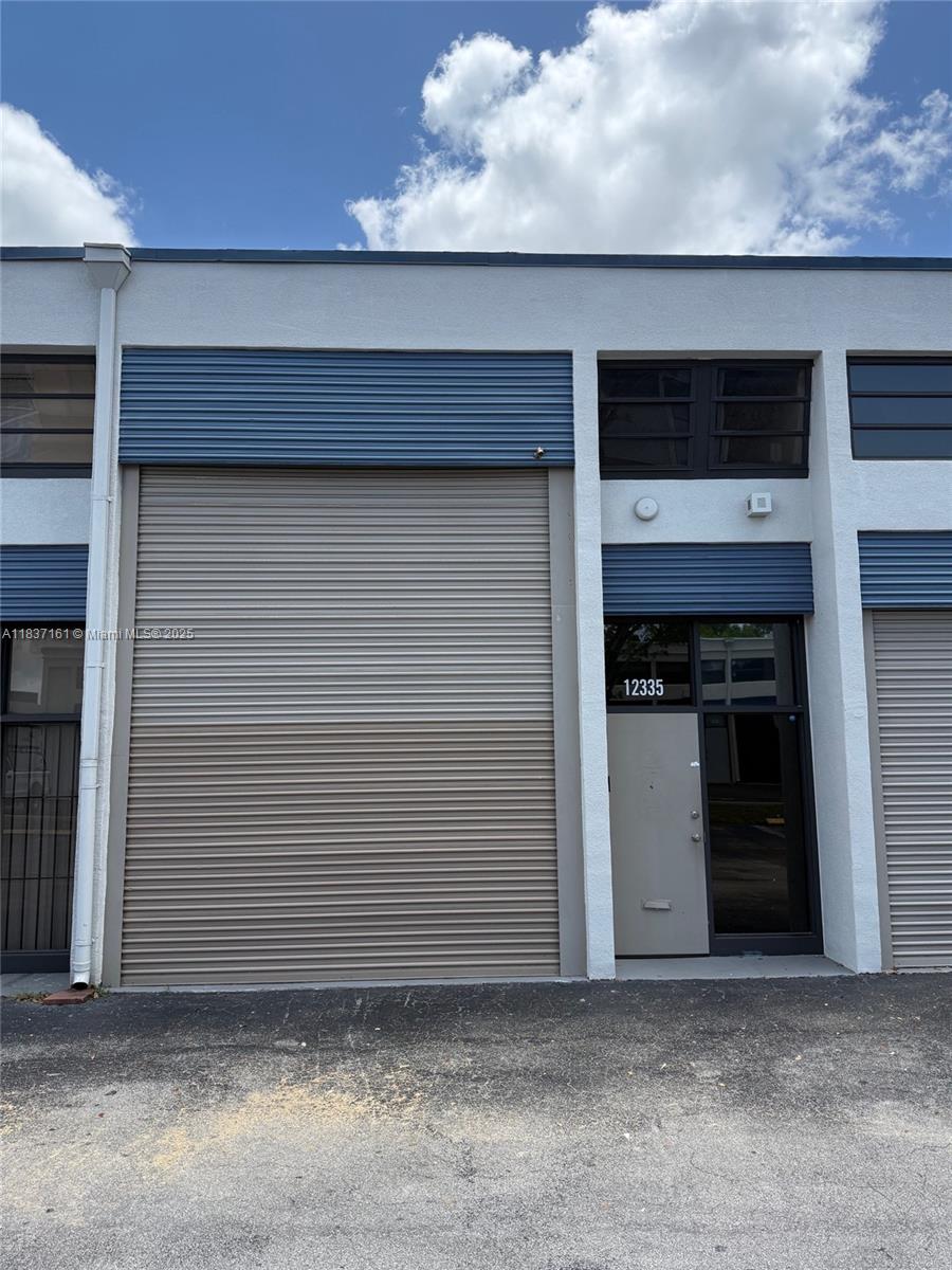 Industrial warehouse unit with 2 assigned parking spaces. Remodeled bathroom, oversized overhead rolling door with an automatic opener and approx 14' opening. 220 Electrical connection. Excellent location with close proximity to the Tamiami Airport, London Square, Gas Stations and expressways. No automotive, mechanic or body shops allowed. Association approval required.