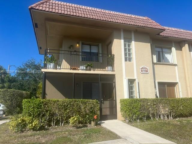 Spacious 2BR/2BA Corner unit with Ceramic tile throughout the entire unit. New S/S appliance will be installed in the upcoming days, the Unit has a screen balcony, granite kitchen and wood cabinets. Washer and dryer in the unit. There is one assigned parking space and plenty of guest parking. The Roof has been replaced in 2023. Come see your next Home to be.