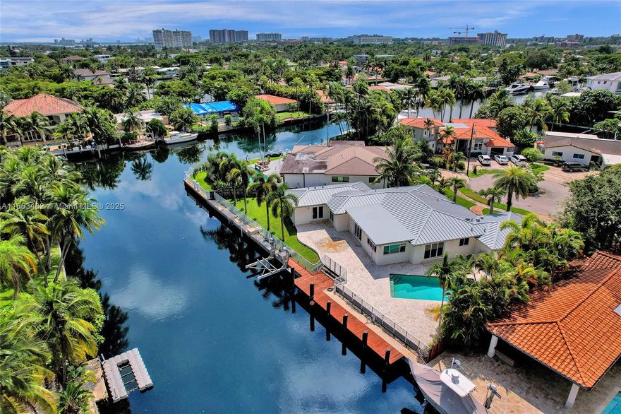 Very rare 150 ft modern waterfront w/direct ocean access opportunity in Gated Keystone Point! Huge 12,300 sqft lot at the end of a cul-de-sac make this home a true gem for waterfront living! No fixed bridges to the bay & fast deep water ocean access. 16K boat lift, updated seawall, shore power. Step inside to a bright, open floor plan w/tons of natural light & a beautifully updated kitchen featuring high-end appliances, gas cooktop, & large center island perfect for entertaining. This spacious home offers 5 beds, 4 baths, 2-car garage, newer metal roof. The primary suite filled w/natural light, abundant closet space & incredible views from the oversized bath w/dual sinks, separate shower & soaking tub. Hurricane impact windows, large patio w/heated pool, built-in BBQ