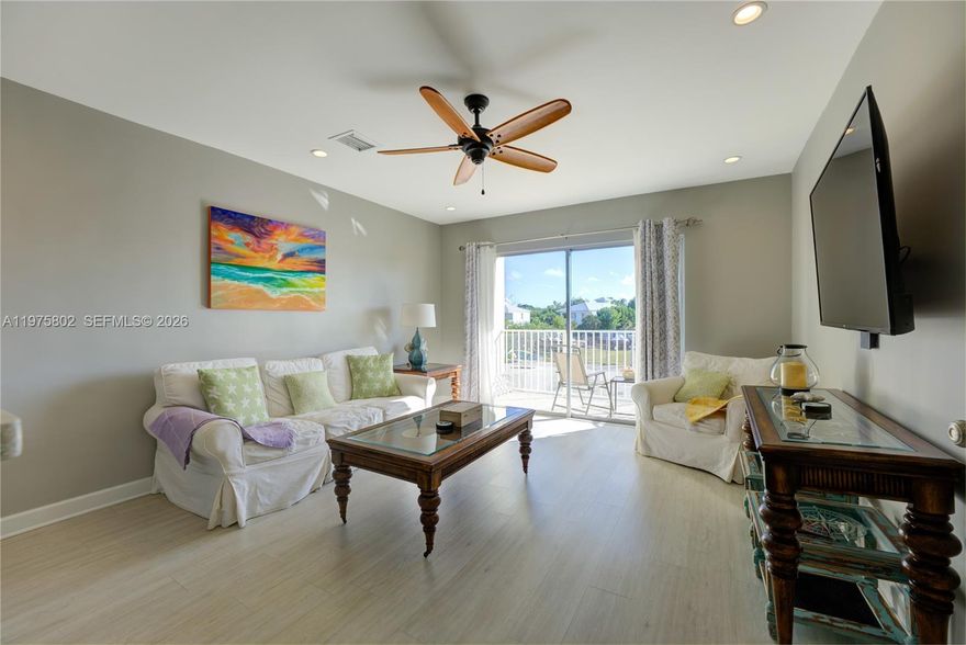 This beautifully updated waterfront condominium captures the essence of the Florida Keys lifestyle along a serene 200-ft-wide deep-water canal with 6+ ft control depth and no bridge clearance restrictions—The residence includes an assigned boat slip accommodating vessels up to approximately 43 ft, providing effortless access to open water. Hurricane-panel-protected sliding glass doors fill the home with natural light and open to a private waterfront balcony, creating seamless indoor-outdoor living for morning coffee or evening relaxation. Inside, modern finishes and a clean coastal design, a turnkey presentation. The property offers flexibility as a primary residence, second home, or income-producing vacation rental. Short-term rentals are permitted with a 7-night minimum. Community amenities include a heated pool, waterfront tiki huts with grilling areas, boat trailer parking, and maintained dockage—perfect for owners and guests. Ideally located in the Middle Keys, the property is minutes from Marathon Airport and about 40 miles from both Key West and Miami via US-1, offering convenient access while preserving a peaceful island setting. Coco Plum Beach is less than a mile away for kayaking, shoreline walks, and unforgettable sunsets. Boat slip fee is $500 annually and has been paid for 2026. Showings accommodated around current bookings; please provide notice when possible. Offered furnished and equipped; a short exclusion list of personal items is available upon request.