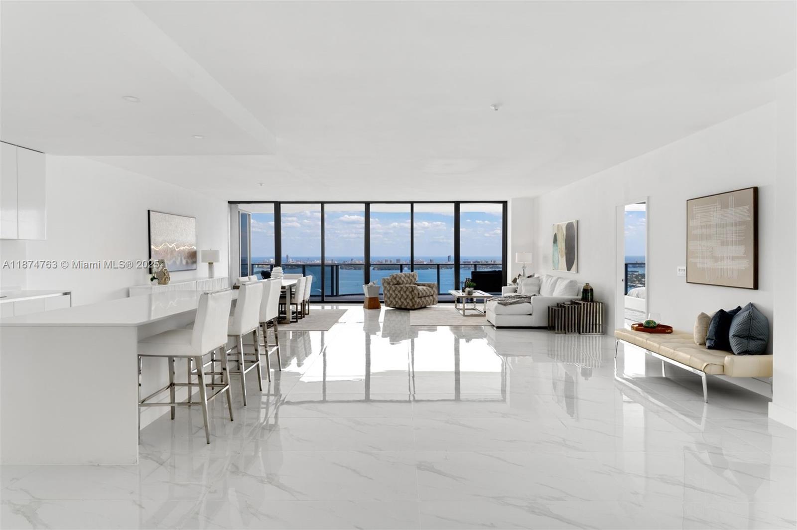 Welcome to Skyview Villa 4702 at Aria Reserve—- an extraordinary residence soaring above Miami on the 47th floor. This brand-new, never-lived-in condo offers 5 bedrooms, 5.5 bathrooms, in 3,670 sq ft of total space and complete privacy, with panoramic views of Biscayne Bay, the Atlantic Ocean, and the city skyline. Floor-to-ceiling impact glass floods the space with natural light, showcasing breathtaking views from every room. Designed for refined living, the open layout provides a serene canvas to personalize your dream home in the sky. With high-end finishes, an open-concept kitchen with Thermador appliances, a spa-inspired primary bath, two private elevators, and three assigned parking spaces, experience elevated luxury in one of Miami’s newest towers.