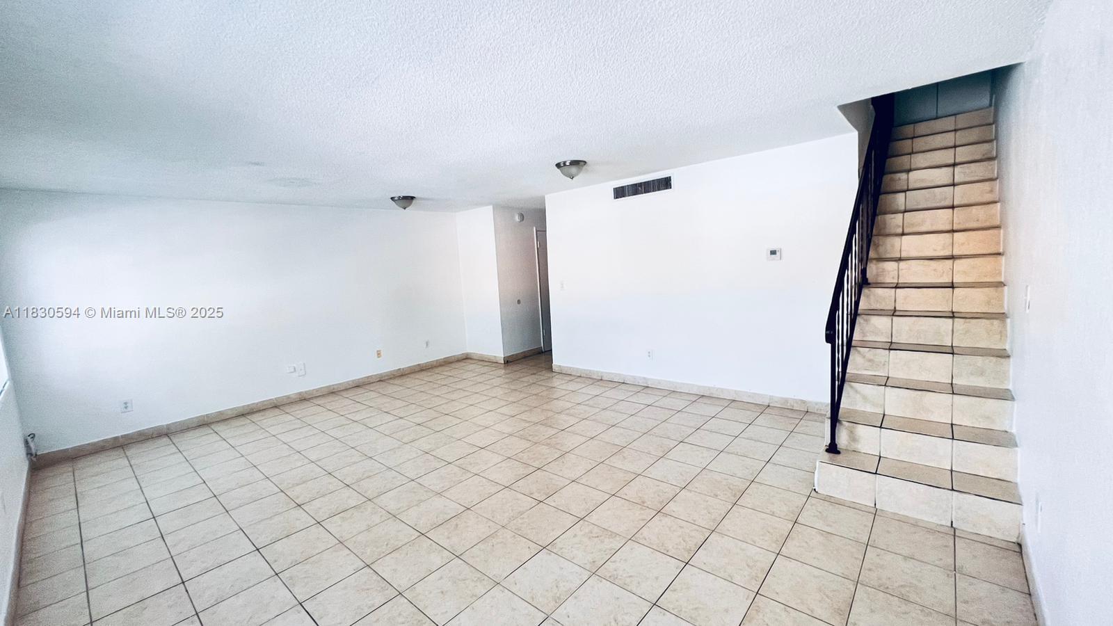 This spacious unit features 2 bedrooms and 1.5 bathrooms. The layout includes a living room, kitchen, and half bathroom on the ground floor, while the upstairs contains the two bedrooms and a full bathroom. It is equipped with a gas stove and has tile flooring throughout. The property is centrally located, providing easy access to highways and malls. Currently, the unit is rented for $2,225 per month until November 2025.