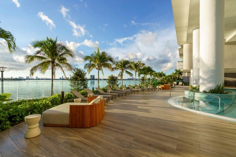 Enjoy the best views in Miami from Aria Reserve! The open panoramic view looks over Biscayne Bay and Miami Beach, you can see the ocean, the port of Miami, and up to Fort Lauderdale. This 4 bedroom corner unit has 5.5 bathrooms, a family room, and a staff room /large laundry room. With over $100,000 in upgrades, including Laurent counter tops, porcelain tile floors, glass in showers, upgraded bathroom mirrors, this home is move in ready. Aria Reserve has over 2 acres of amenities: 3 pools, 3 hot tubs, fitness center, spa, game room, kids room, kids splash area, putting green, 3 BBQ areas, tennis, padelball, pickleball, basketball, and more! TWO parking spaces included (each a $100,000 value)!