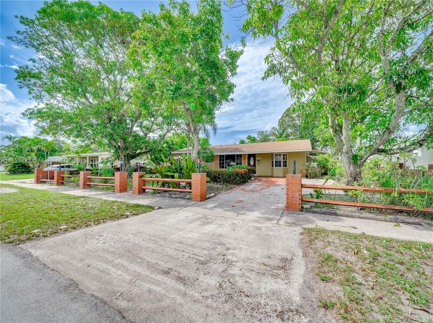 This charming 3-bedroom, 2-bathroom single-family home in the heart of Hollywood offers a well-designed layout with formal living, dining, and family rooms. The kitchen boasts sparkling granite countertops and stainless steel appliances. Enjoy a spacious laundry room with an energy-efficient tankless water heater, providing endless hot water. The private backyard oasis features established mango trees and a variety of garden plants, ideal for outdoor enjoyment. No HOA fees. Conveniently located near shopping, schools, Broward College, and major highways.