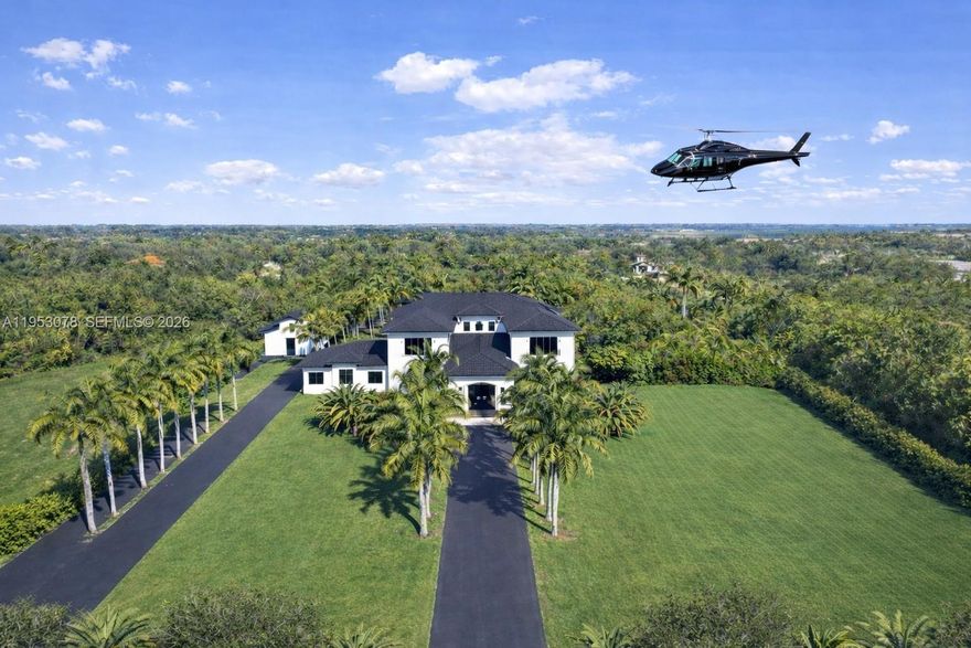 A distinguished five-acre estate offering an exceptional level of privacy, security, and space within Lindbergh’s Landing, a private, gated aviation and equestrian community.

Designed for those who value discretion and tranquility, the property offers private aircraft and helicopter access via its own grass runway—an exceedingly rare amenity in South Florida. Thoughtfully positioned within this quiet and peaceful enclave, the estate provides a serene, highly secure environment with complete separation from neighboring properties.

The approximately 10,000-square-foot main residence and 2,300-square-foot guest house have been comprehensively renovated with refined, contemporary finishes and are presented in impeccable, move-in-ready condition.

The grounds are gracefully composed and newly enhanced with horse stables and a private spa, in addition to two pools, a racquetball court, a basketball court, and expansive manicured green space, allowing for both private recreation and future personalization. The scale, layout, and security of the property lend themselves naturally to a private family compound or a secluded retreat.

Situated approximately 30 miles west of Downtown Miami, this exceptional offering is ideally suited for the discerning buyer who demands uncompromising privacy, security, and space in a quiet, serene setting, while remaining within reach of the city.