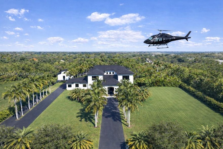 A distinguished five-acre estate offering an exceptional level of privacy, security, and space within Lindbergh’s Landing, a private, gated aviation and equestrian community.

Designed for those who value discretion and tranquility, the property offers private aircraft and helicopter access via its own grass runway—an exceedingly rare amenity in South Florida. Thoughtfully positioned within this quiet and peaceful enclave, the estate provides a serene, highly secure environment with complete separation from neighboring properties.

The approximately 10,000-square-foot main residence and 2,300-square-foot guest house have been comprehensively renovated with refined, contemporary finishes and are presented in impeccable, move-in-ready condition.

The grounds are gracefully composed and newly enhanced with horse stables and a private spa, in addition to two pools, a racquetball court, a basketball court, and expansive manicured green space, allowing for both private recreation and future personalization. The scale, layout, and security of the property lend themselves naturally to a private family compound or a secluded retreat.

Situated approximately 30 miles west of Downtown Miami, this exceptional offering is ideally suited for the discerning buyer who demands uncompromising privacy, security, and space in a quiet, serene setting, while remaining within reach of the city.
