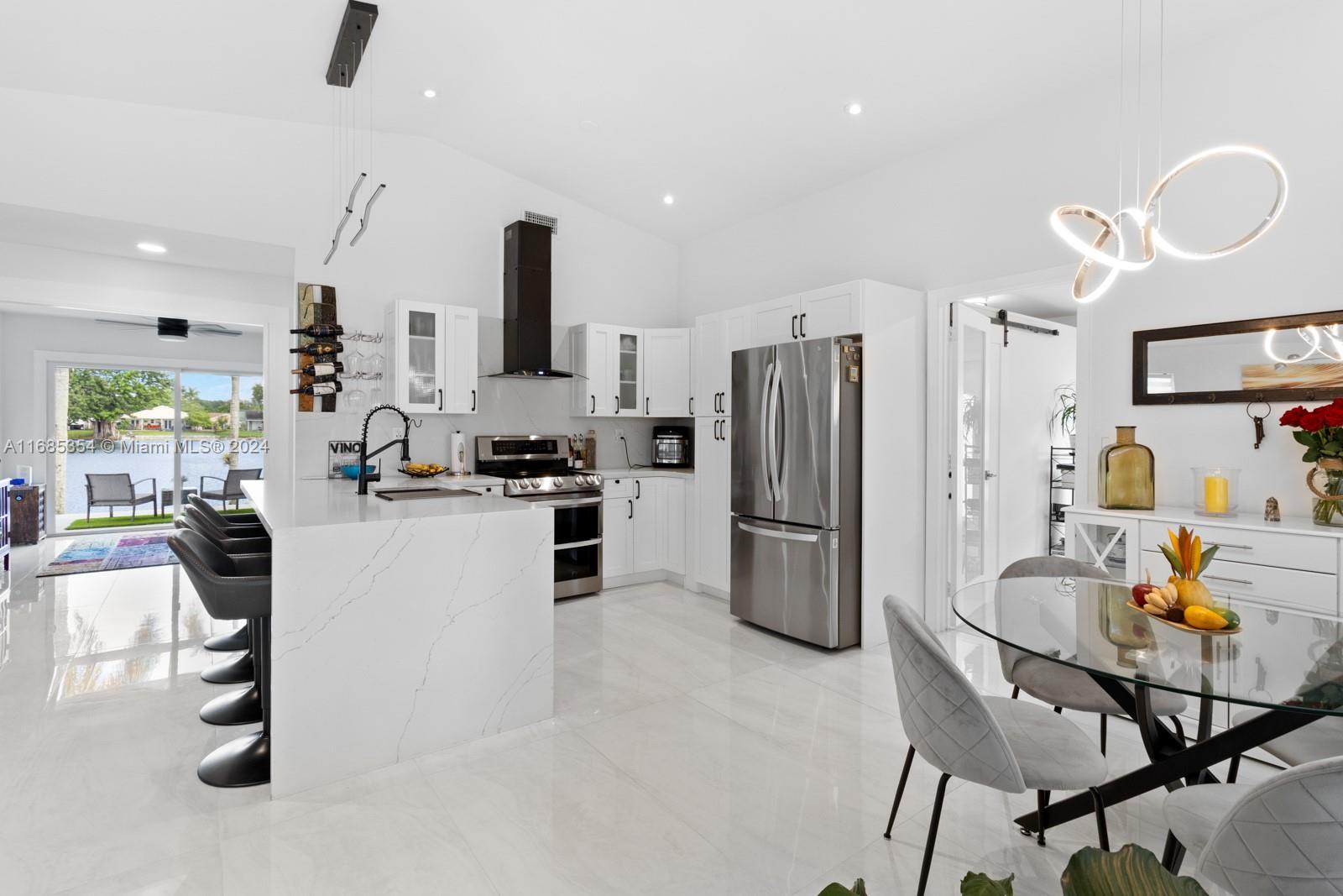 Imagine waking up every day to stunning lake views from this cozy yet comfortable home. With 12-foot ceilings and recessed lighting, it feels open and inviting. The bright, white kitchen features new stainless-steel appliances and a large island that opens to the family room and summer kitchen—perfect for gathering +garage converted to office.
Step out to the spacious 42' x 12' patio, ideal for barbecues, with an outdoor kitchen and granite countertop. This home includes high-impact windows and doors, a newer roof, updated plumbing, and ample parking, space for a boat.
Located in a top-rated school district and close to major highways, shopping, Cleveland Clinic, and parks, this small home maximizes comfort and convenience. Don't miss this rare opportunity with breathtaking lake views!
