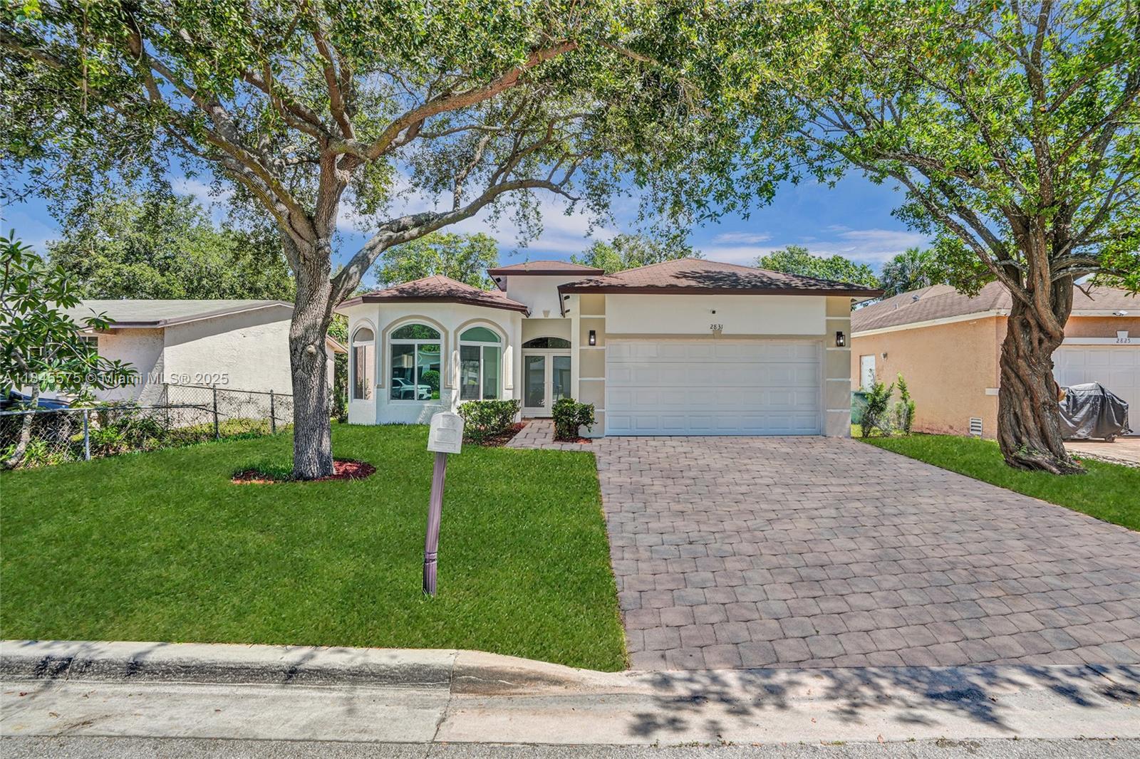 Beautifully updated 1-story home featuring soaring high ceilings and all impact doors and windows for added security and energy efficiency. This spacious 4-bedroom, 2-bath layout includes a flex room that can serve as a dining area or entertainment space. The interior offers a smooth, connected layout ideal for everyday living. The primary suite features a walk-in closet, a walk-in shower, and a separate soaking tub. A well-appointed kitchen, dedicated laundry room, and 2-car garage complete this move-in-ready home.