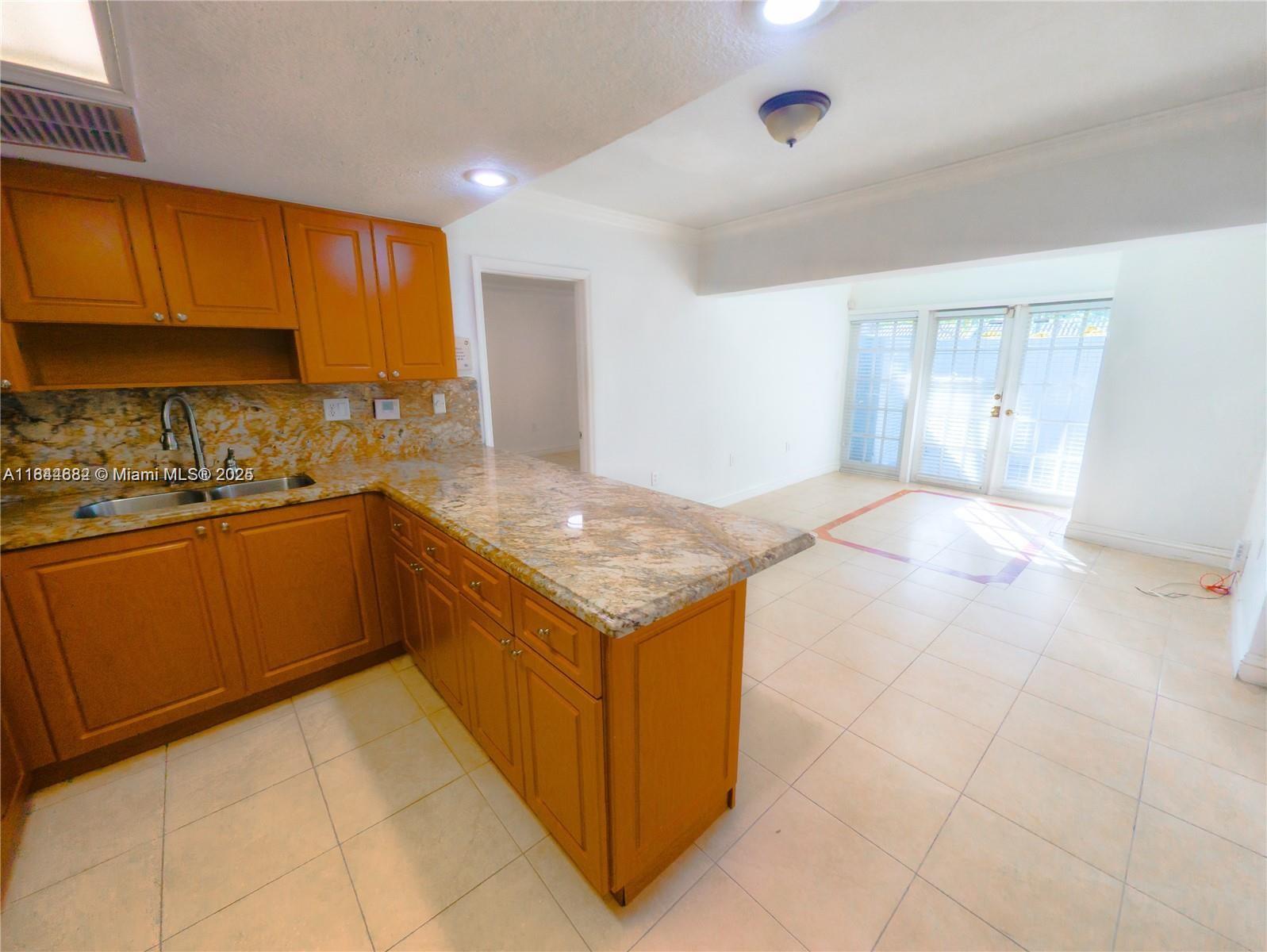 Enjoy Miami Lakes living in this updated 1-bedroom, 1-bath condo. The spacious master bedroom, high ceilings, sleek tile flooring, and a modern kitchen with granite countertops. Washer Dryer in Unit!! Enjoy a spacious private patio, perfect for relaxation or entertaining. Located in a quiet, safe neighborhood, this residence is ideal for those seeking a serene lifestyle with easy access to nearby shopping and dining. First last and deposit required. Utilities not included in rent. Landlord prefers 1 Occupant