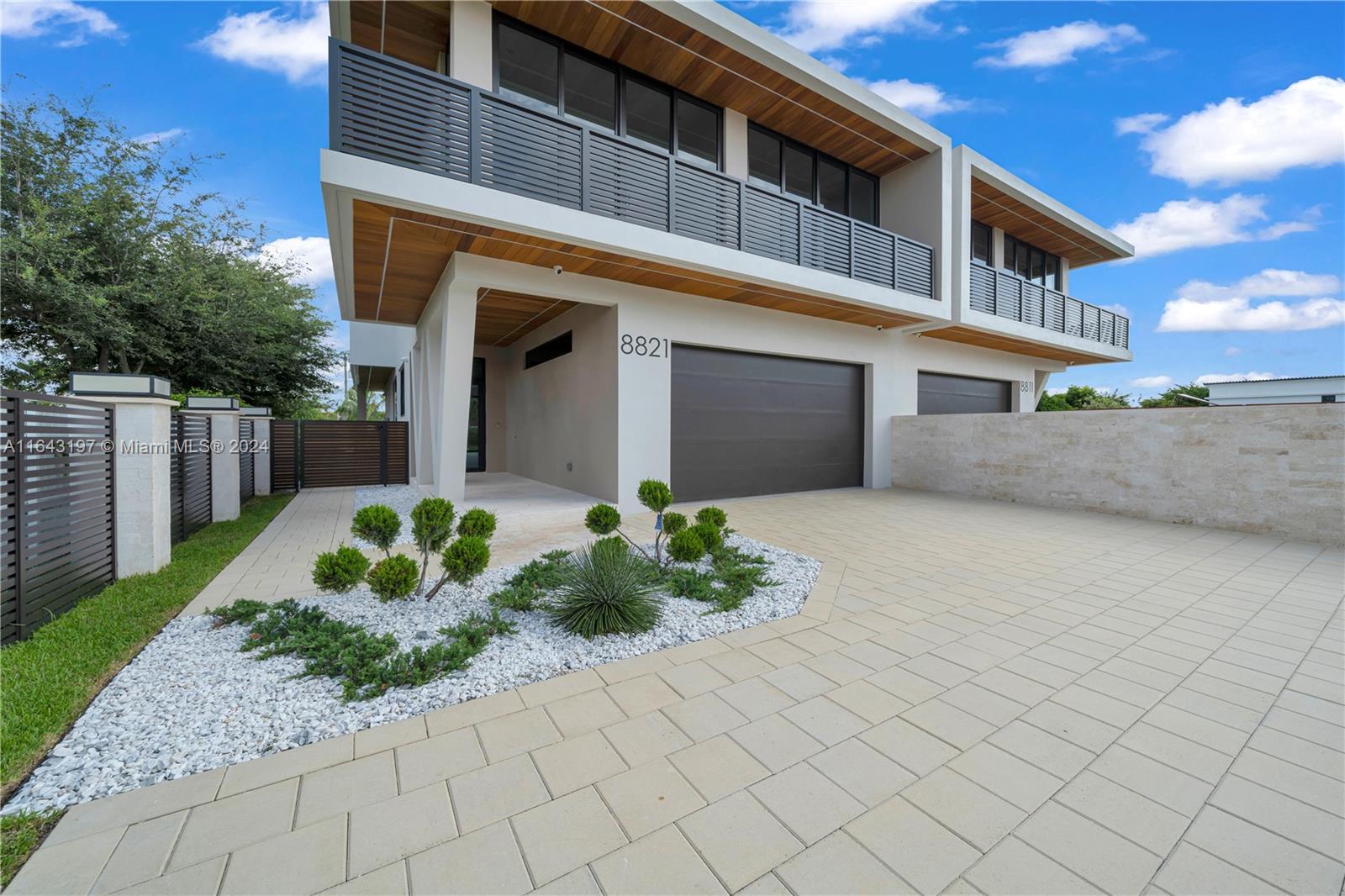 This brand new, luxurious 2-story twin home is perfectly situated in the heart of Miami, near top-rated schools, popular local hotspots, and a large public park. Spanning nearly 3,400 square feet of living area with over 4,610 total square feet, this fully gated residence features 4 bedrooms, 5 full bathrooms, with a large open concept kitchen/living room and butler's pantry that connects to a 2 car garage that is EV ready for 2 vehicles. The home's interior is beautifully finished in imported porcelain tile throughout and the exterior in imported natural coral stone and Brazilian teak hardwoods. MUST SEE!