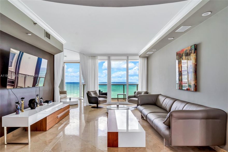 Experience the epitome of coastal elegance in this beautifully renovated 2-bed plus den, 2.5-bath residence. Float through this exquisite home & be captivated by direct, panoramic views of the Atlantic Ocean and the Intracoastal. Each day begins with a refreshing breeze from your sunrise terrace & ends with stunning sunsets from your sunset terrace. Indulge in a top-of-the-line kitchen featuring custom cabinetry & premium appliances, including a Bosch oven and dishwasher, and a Samsung Wi-Fi–enabled refrigerator with radio. Enjoy abundant built-in storages, a 160-bottle wine cooler in a chic wall unit, & a designer front door that sets the tone for elegance. This is luxury coastal living at its finest, blending modern design, comfort, & breathtaking views in the heart of Sunny Isles Beach.