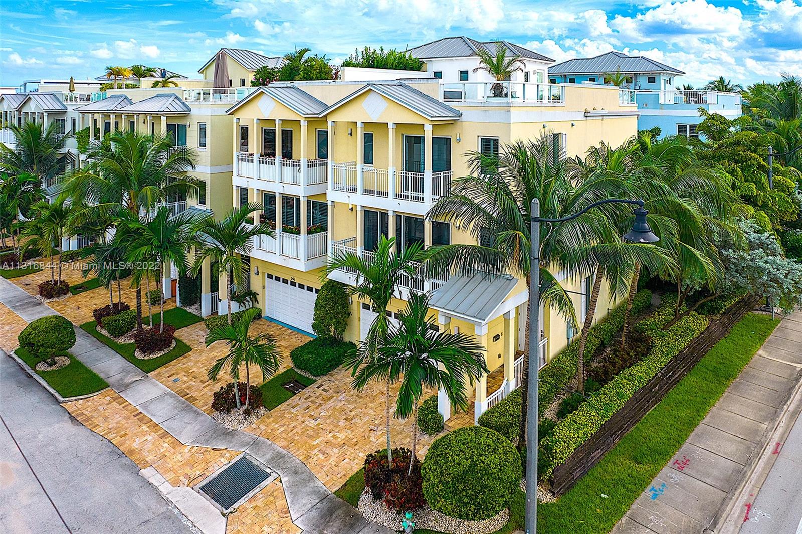 Live just steps from the sands of the Atlantic Ocean! Features a private roof deck which spans 1,400 sq. ft. with breathtaking Ocean, Intracoastal and City views, perfect for relaxing and hosting gatherings. Beautiful sunrise and sunsets, over 3200 sq. ft. of living area, every bedroom is a suite (with private bath), private elevator to every floor including roof terrace. This 3-Story home features all impact windows & doors. Corner unit with extra windows which provides for a bright sun filled interior. Other features include a 2 car garage, elevator, hot tub, open entertainer's kitchen, custom closets, freshly painted interior, and a separate laundry room. Great opportunity to live the S. Florida lifestyle in central location between Miami & Fort Lauderdale. No Short Term Rentals.